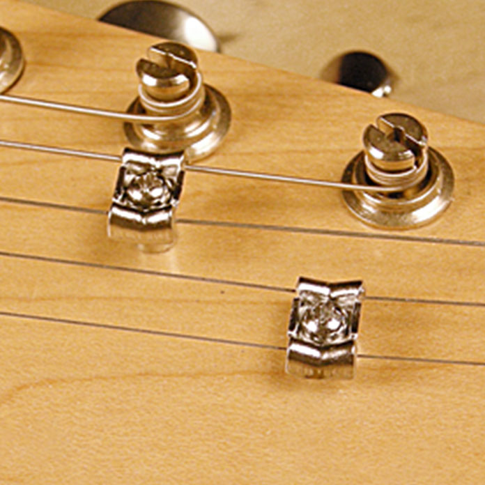 Saitenniederhalter + Seitenführung