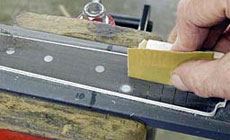 Photo: sanding the fingerboard